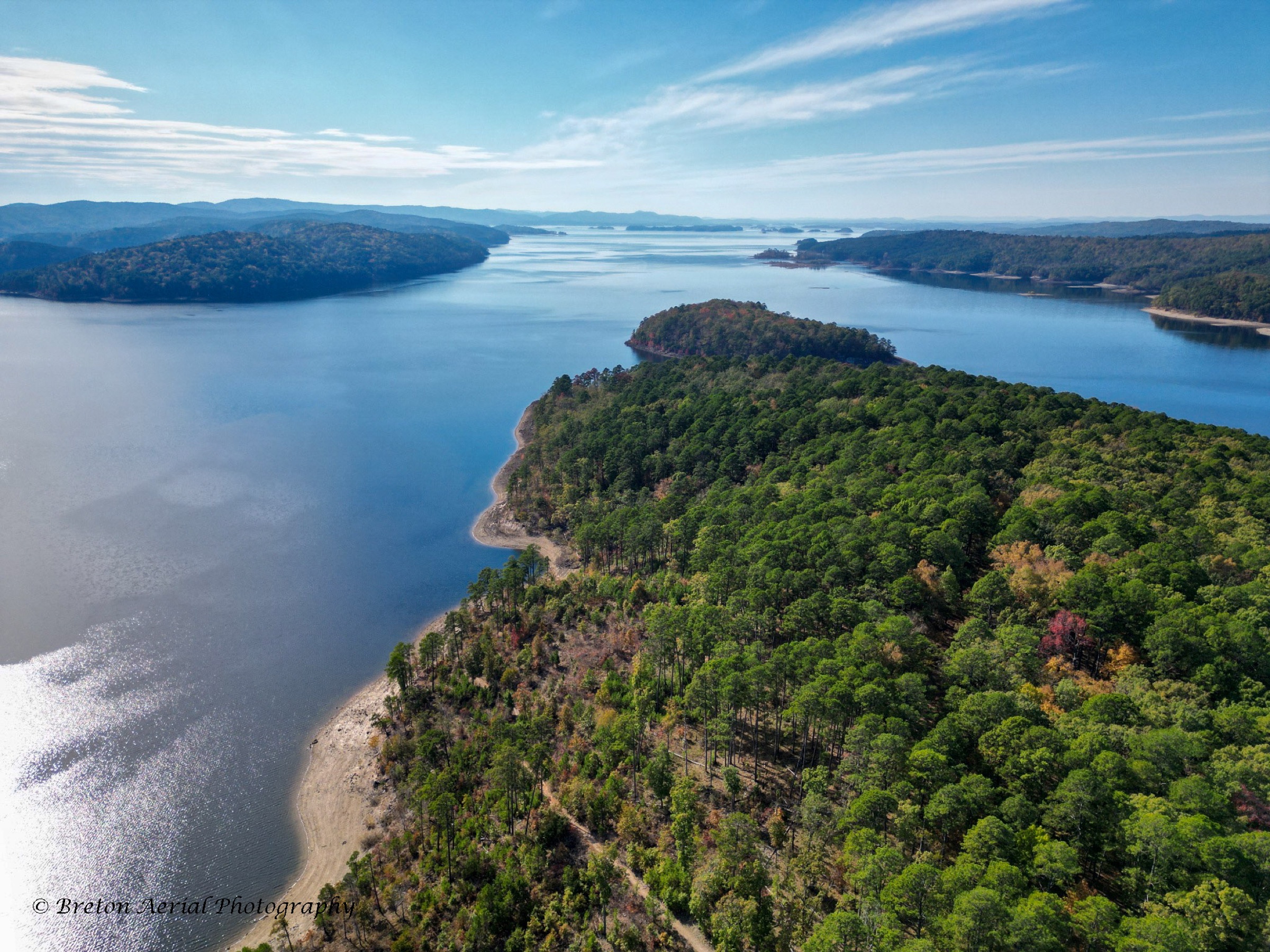 Sweeping aerial view across Lake Ouachita and forested islands